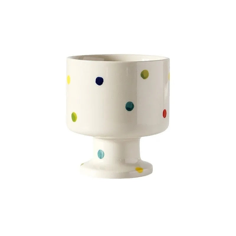 Hand-pinched irregular ceramic mug in solid colour with modern design