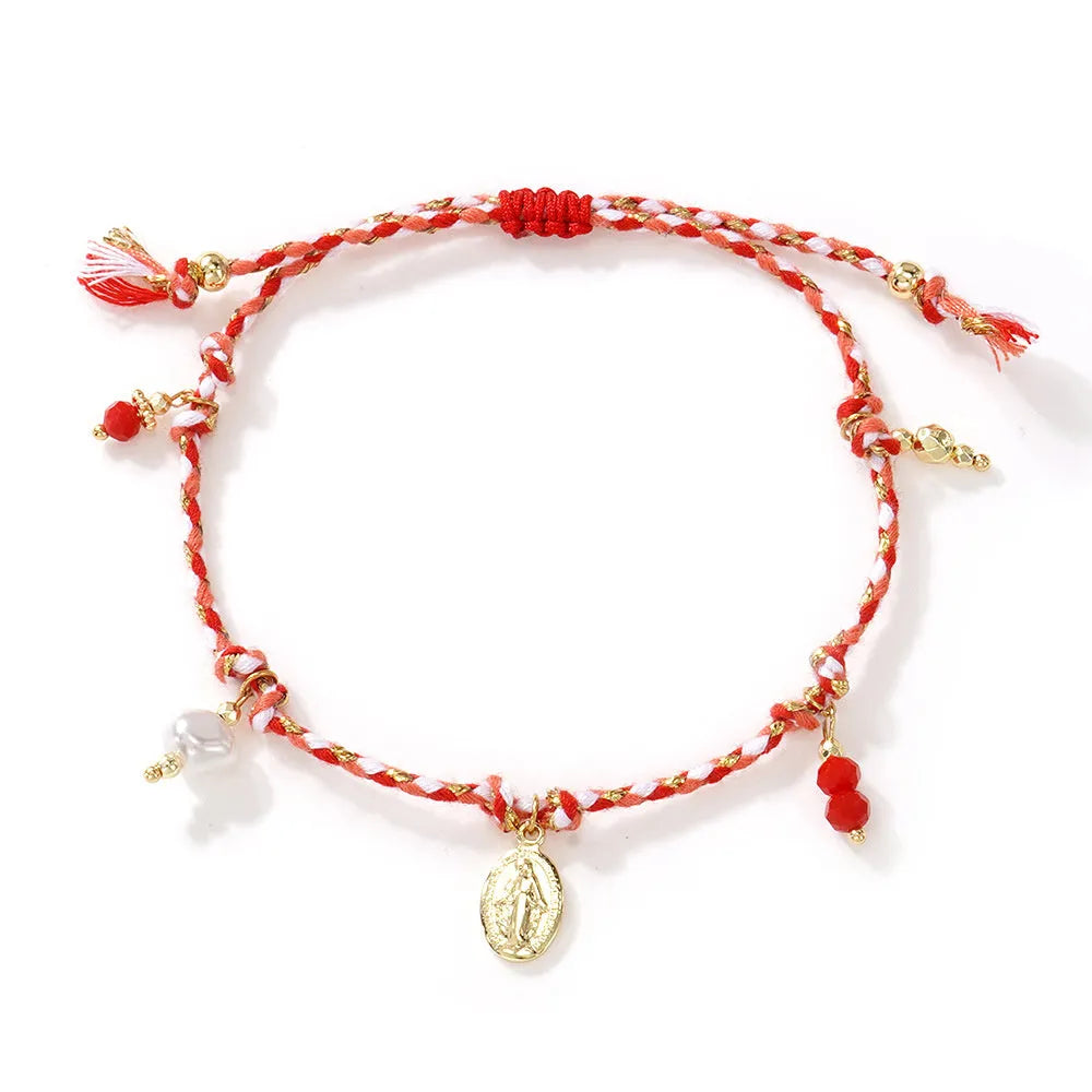 Hand-woven women's bracelet made from colourful braided rope with an integrated carrying strap tag design.