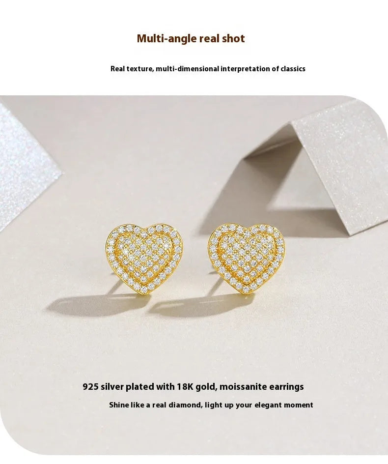 A pair of gold-coloured heart-shaped hoop stud earrings with moissanite stones on S925 sterling silver posts.
