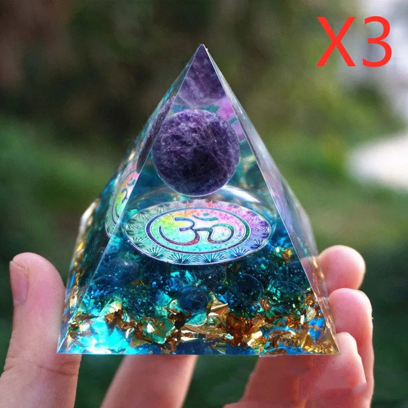 Clear epoxy resin pyramid ornament with embedded blue lapis lazuli crystal gravel, 6cm tall.