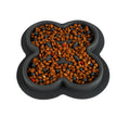 Silicone pet licking pad slow feeder mat in various colours on a floor