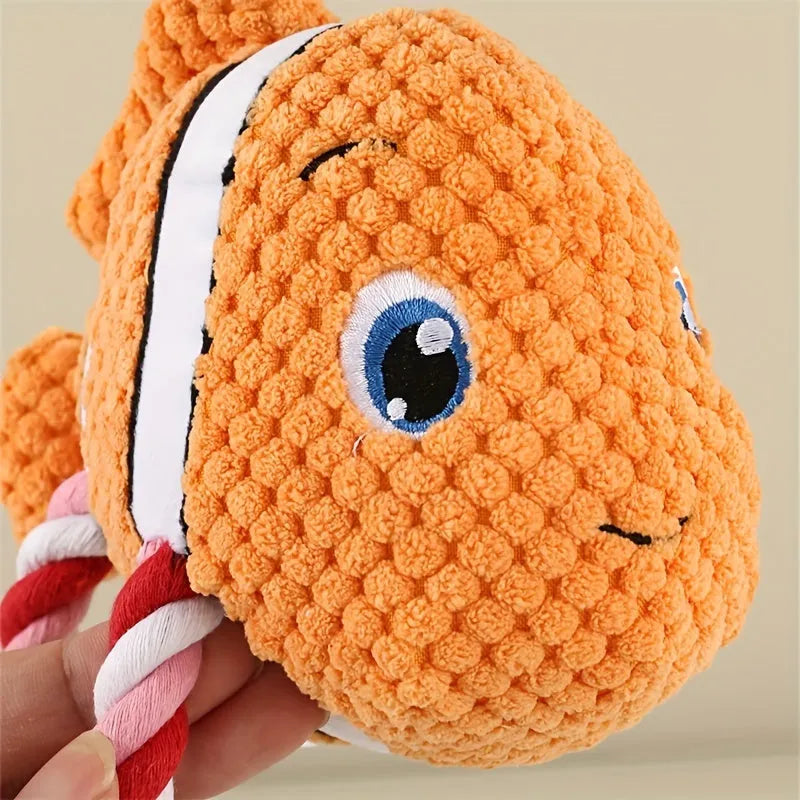 Turtle-shaped dog toy with knotted rope construction and plush stuffing for interactive chewing games