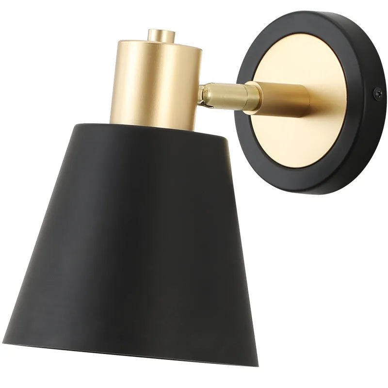 Nordic-style iron wall lamp mounted beside a bed with adjustable LED lighting