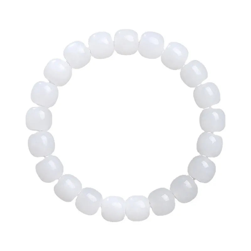 White Hetian jade barrel bead bracelet shown in three bead size variations on a wrist.
