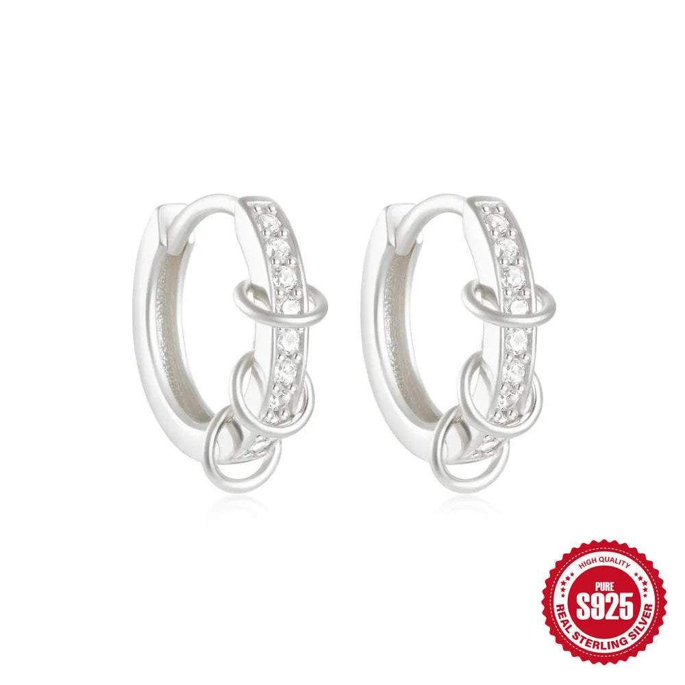 Sterling silver geometric stud earrings with round diamond accents in gold and silver electroplated finishes
