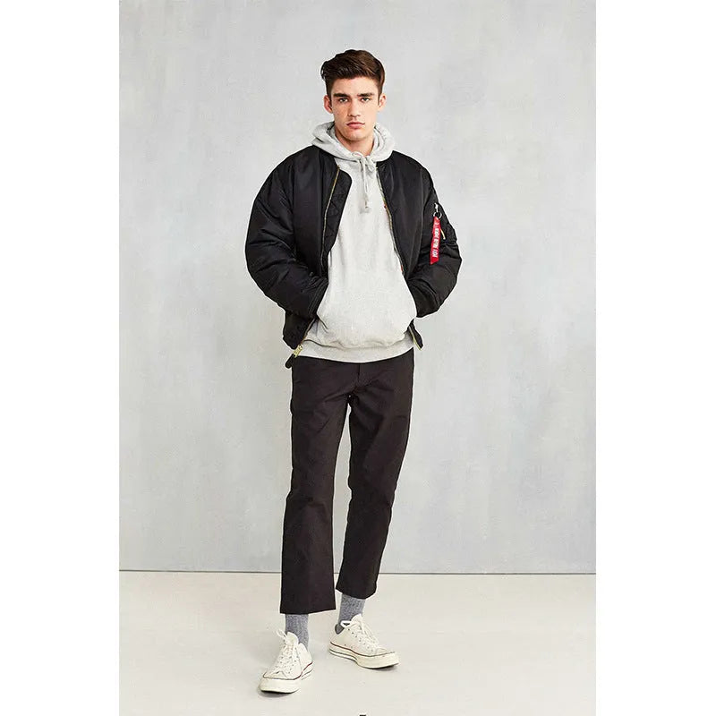 Men's loose fit army green nylon pilot jacket with cotton padding on a mannequin.