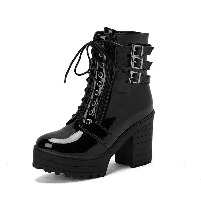Women's black thick-heeled short boots with lace-up front and round toe on a waterproof platform.
