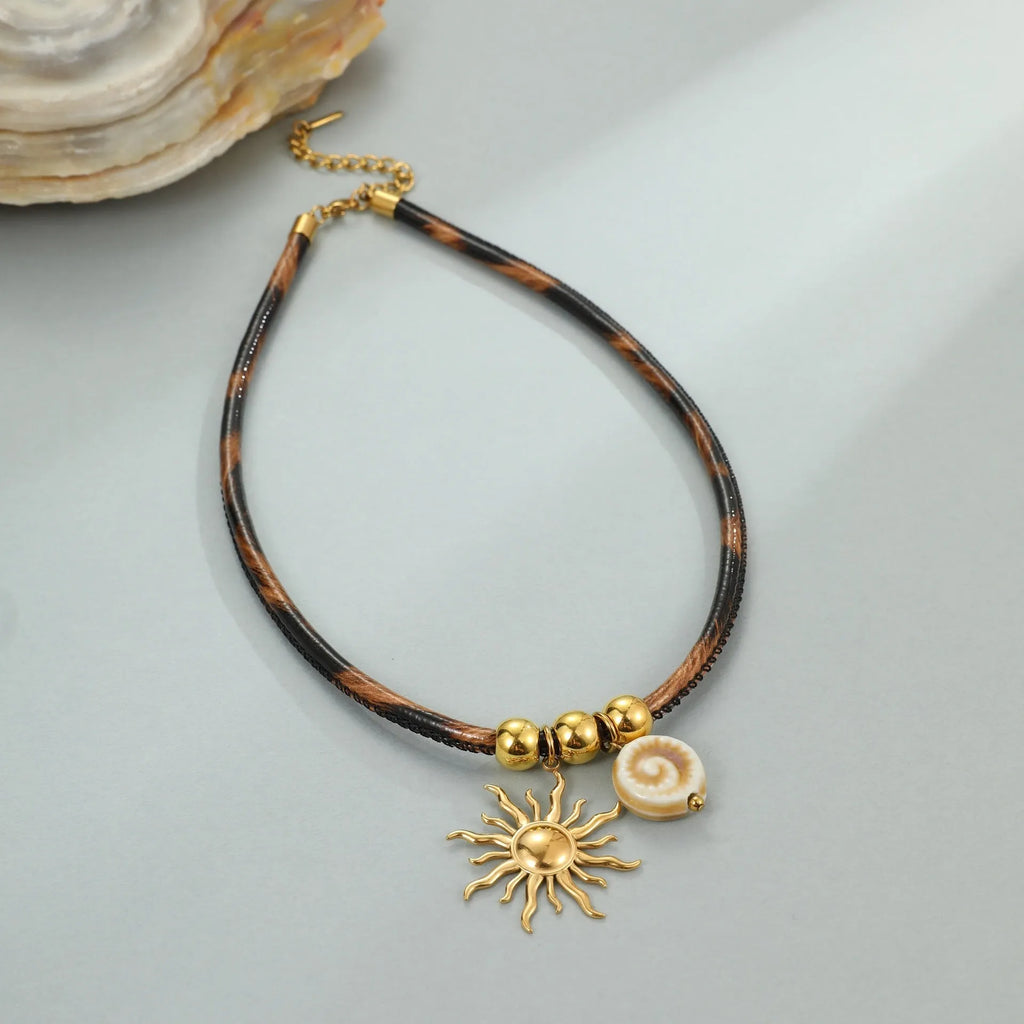 Women's stainless steel necklace with leopard print geometric pendant and gold electroplated finish