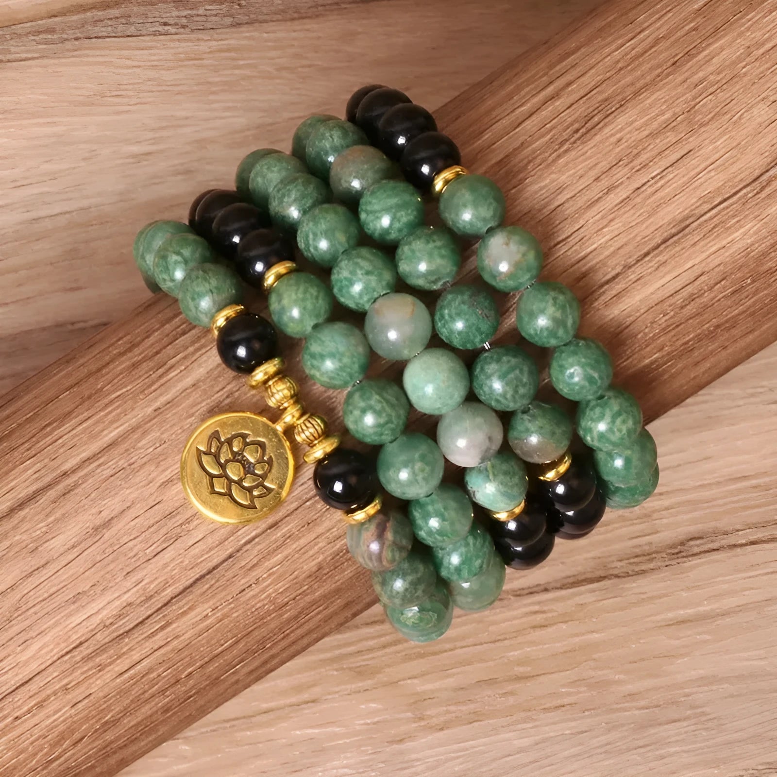 Green and black elastic beaded fashion bracelet with alloy clasp showing adjustable design