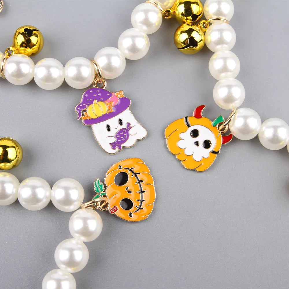 Halloween pearl necklace pet collar with pumpkin designs in purple ghost, skull, and smiling variations