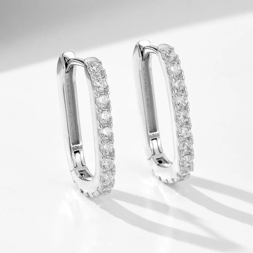 Sterling silver oval zircon ear clips with geometric design in white or yellow finish