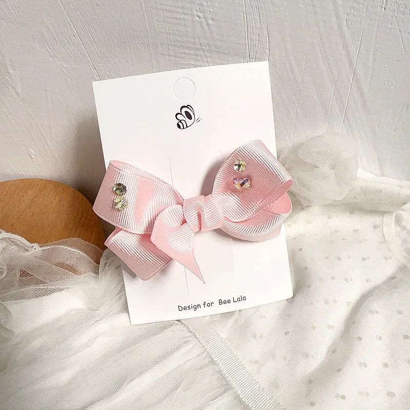 Children's press clip hair accessories set with cloth bows, sequins, pearls, and crystal flowers in pink and beige