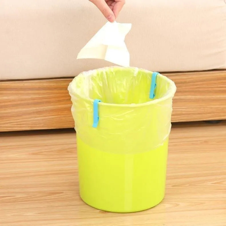 White PP plastic side-fixed clip for holding a bin bag on a trash can rim.