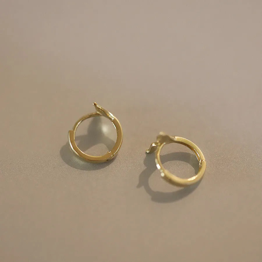 S925 sterling silver fishtail earrings in gold and white gold colours with 8mm inner diameter