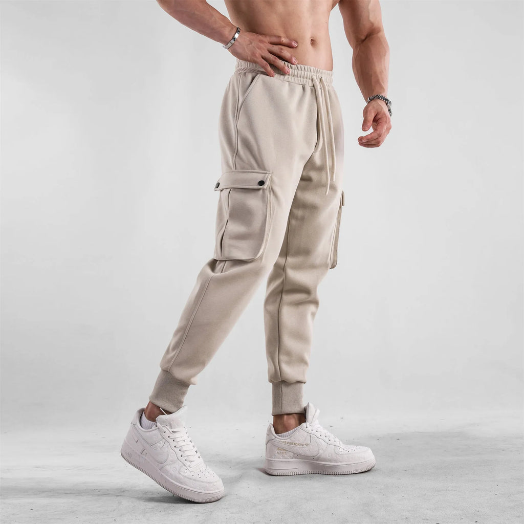 Men's cotton sports trousers with ankle ties and multiple pockets in apricot colour