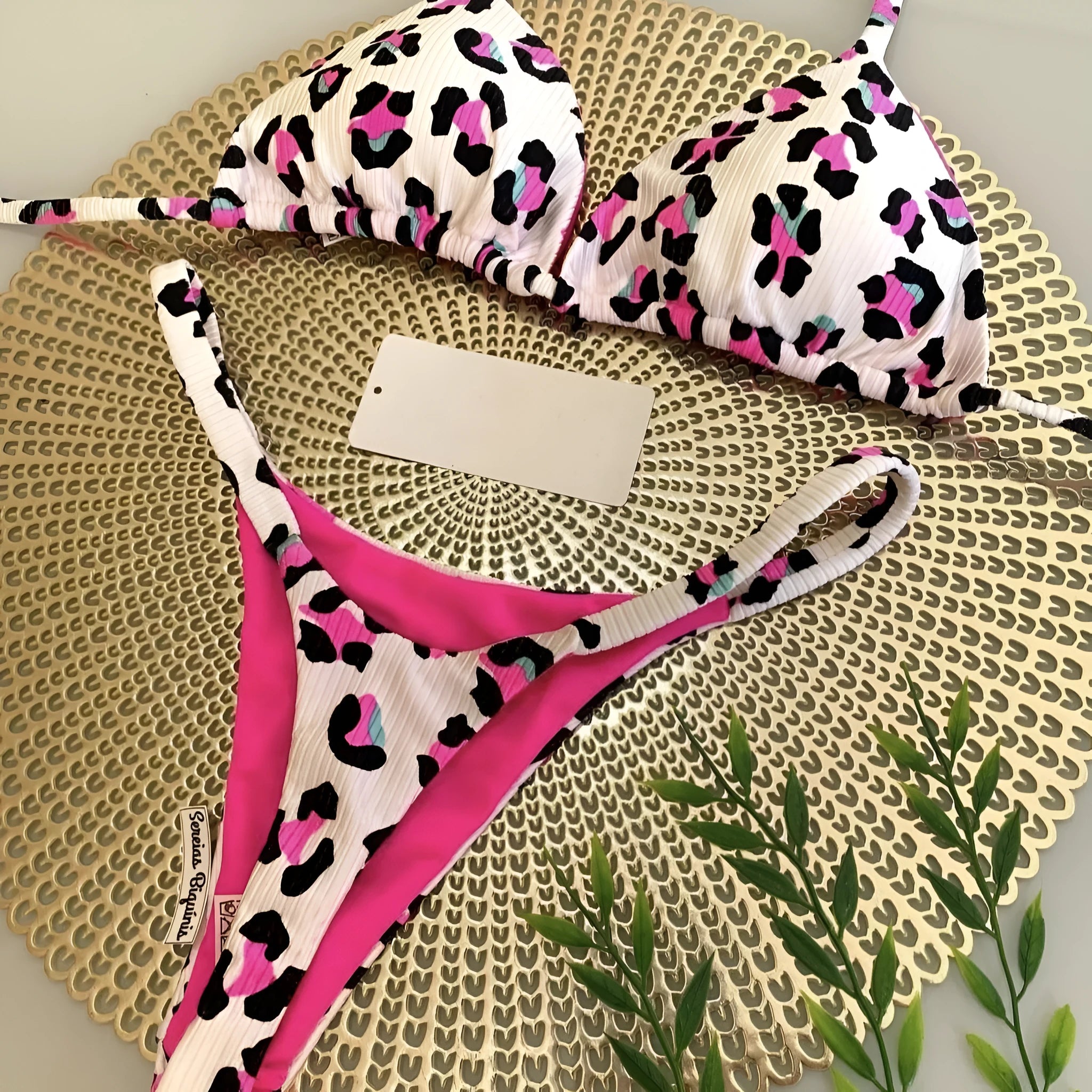Women's printed bikini swimsuit with briefs style on a neutral background.