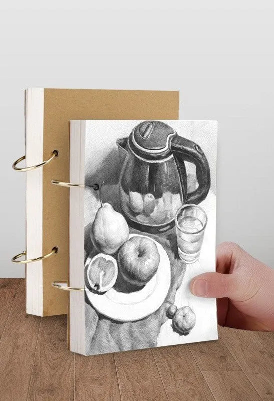 Thickened 8K sketchbook with 70 sheets, detachable coil binding, open to a marker drawing on white paper