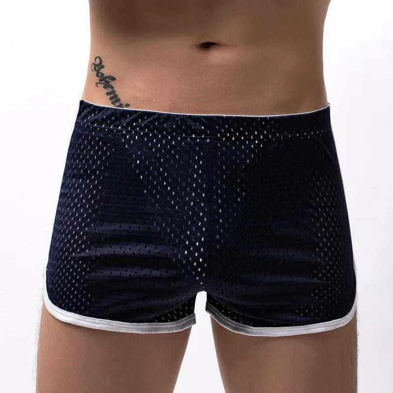 Men's knitted cotton three-point boxer shorts in black, grey, blue, and white colours laid flat.