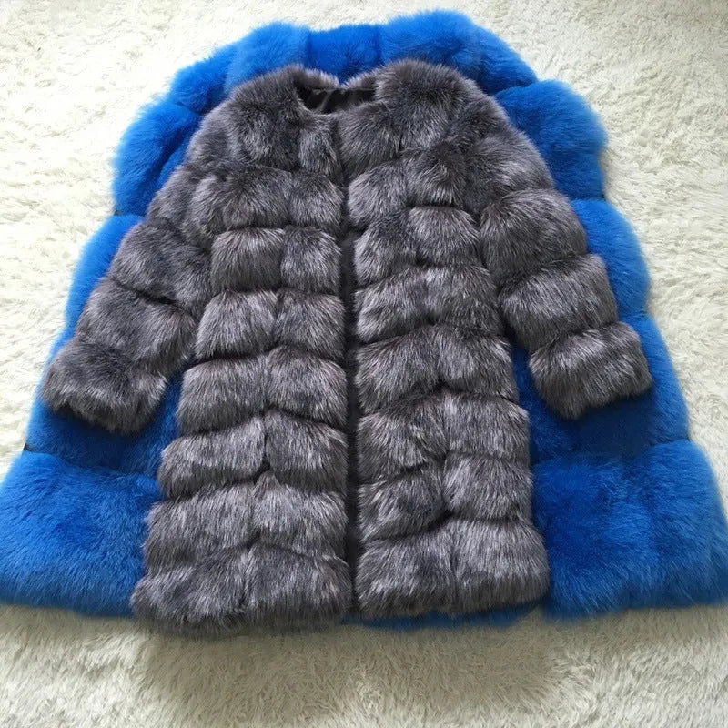 Women's long artificial fur coat in wine red colour on a hanger