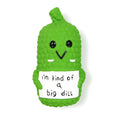 Green pickle-shaped squeaky dog chew toy with textured surface.