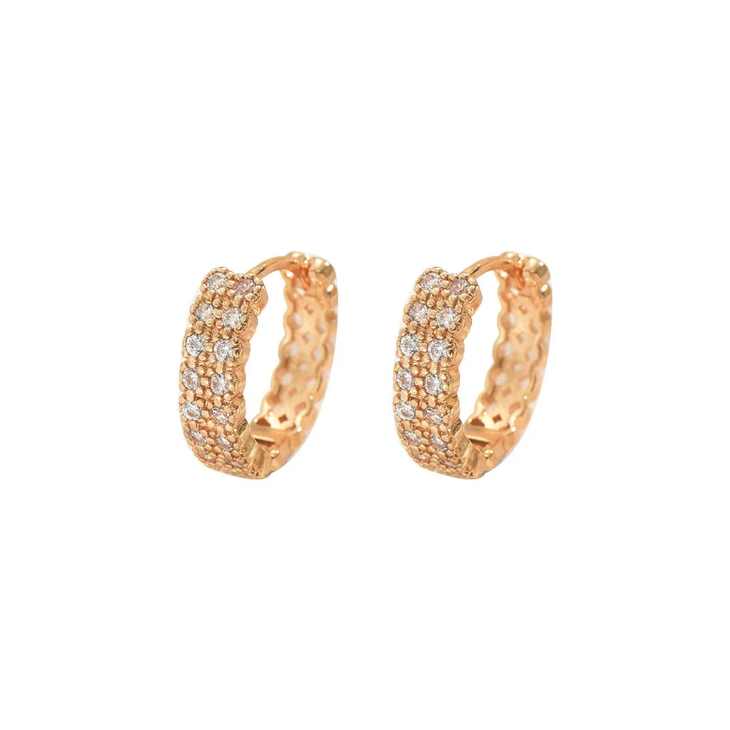 Copper geometric pattern ear studs with round, dot, and ring design elements.