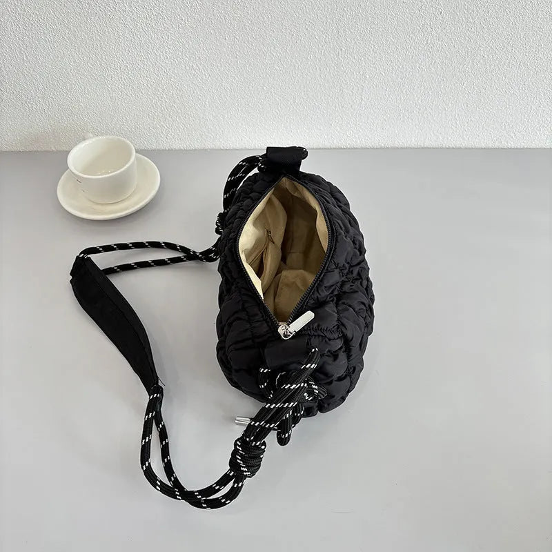 Women's lightweight nylon messenger bag in pillow shape with crossbody strap and rhombus pattern