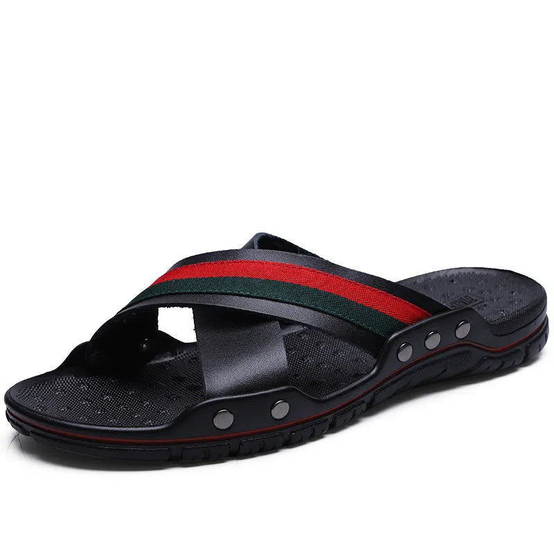 Men's white cowhide leather flip flops with a non-slip PU sole on a beach background.