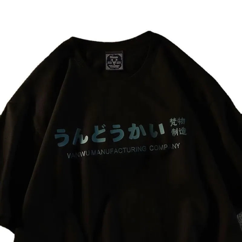 A loose-fitting black cotton t-shirt with a white letter print, shown on a hanger.