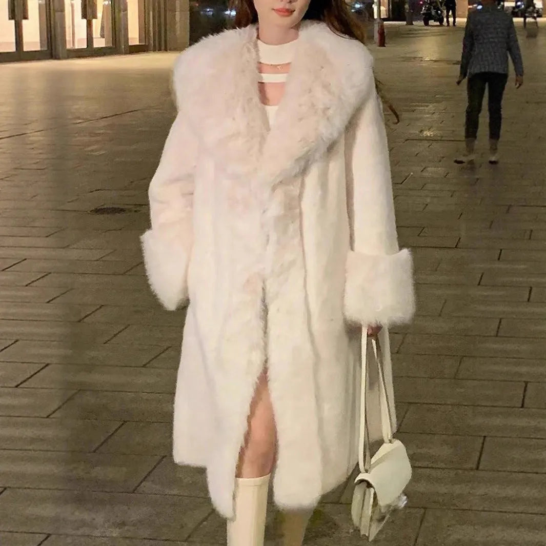 Women's grey thick faux rabbit fur mid-length coat with a fur collar on a hanger.