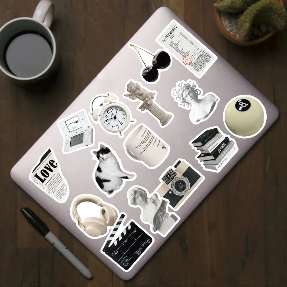 61 black and white PVC waterproof stickers for laptops, phones, luggage, and skateboards.
