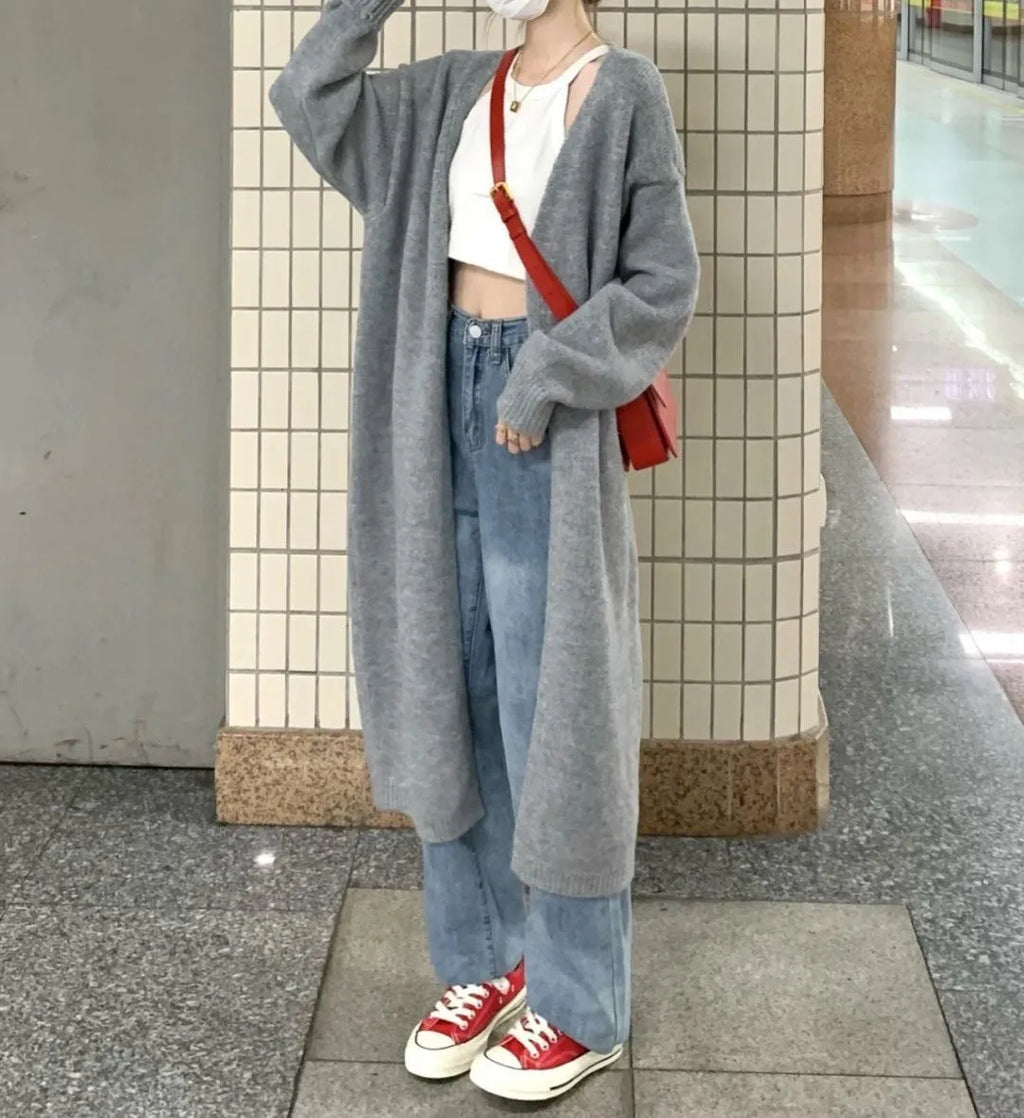 Loose thick chenille cardigan for women in a dark grey colour, showing 3D pattern and mid-length fit.