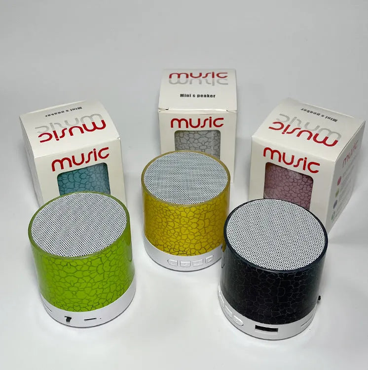 A9 Mini Cracked Bluetooth Speaker in blue with LED lights on a table