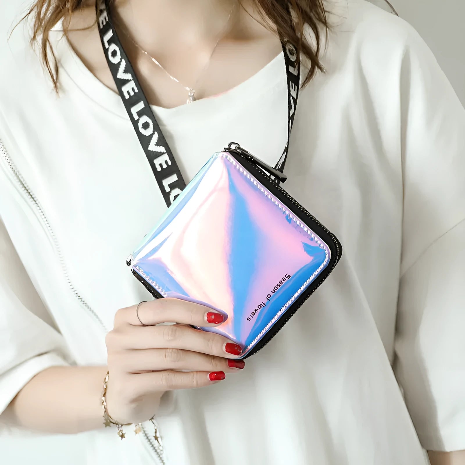 Women's short folding Korean-style wallet in glitter blue or green colours showing 11cm dimensions