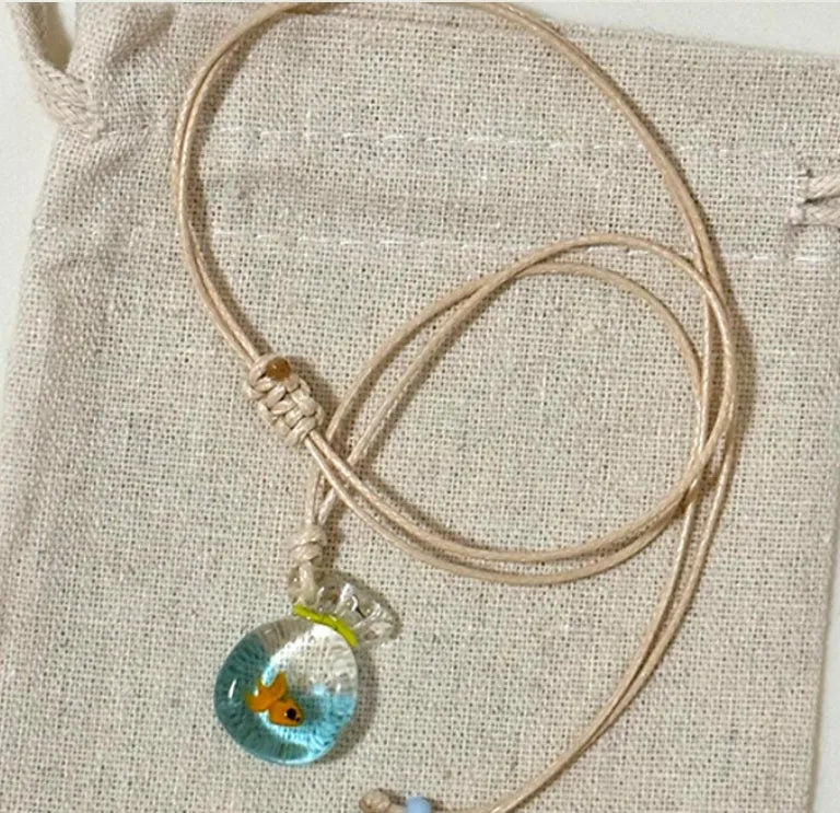 Women's necklace with coloured glaze joker skirt pendant on a cotton linen clavicle chain