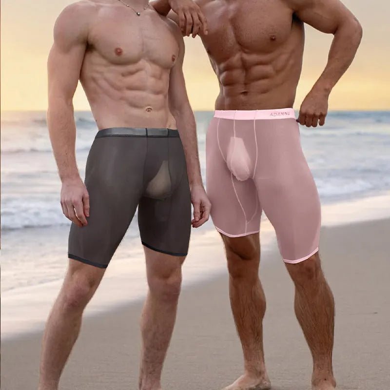 Men's solid colour nylon mesh home shorts in black, shown on a hanger.