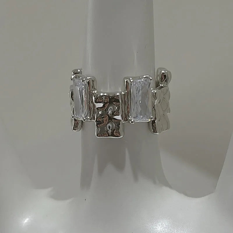 Silver-plated geometric open ring with cross zircon centrepiece and three-dimensional decoration