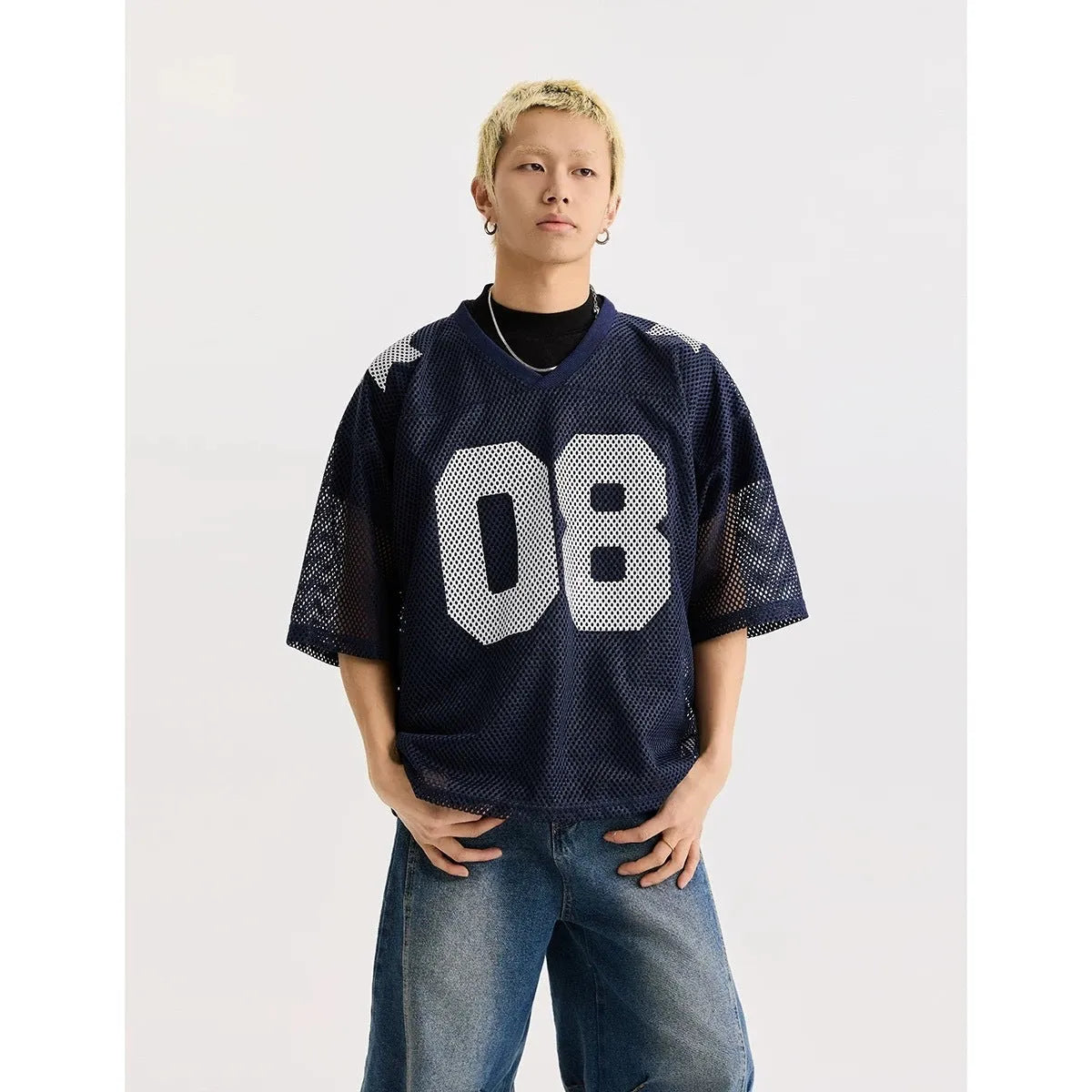 Letter pattern pullover shirt in loose fit with short sleeves available in black or navy blue