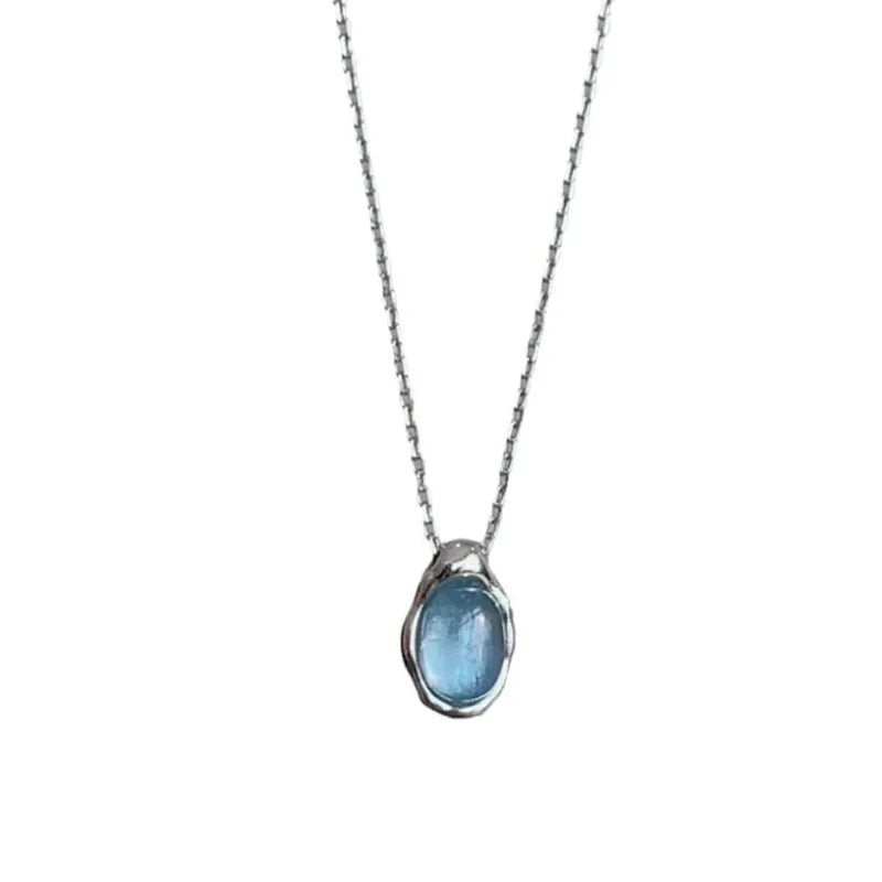 Navy blue water drop pendant necklace with platinum-colour finish on adjustable copper cross chain.