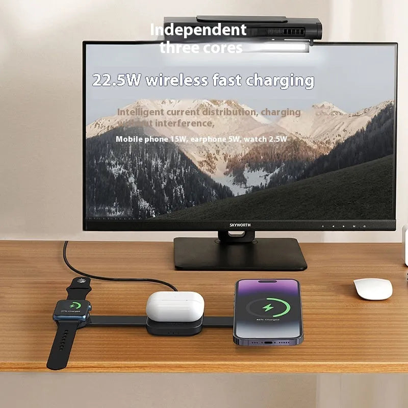 Three-in-one magnetic wireless charger stand in dark grey with a smartphone, watch, and earphones placed on it