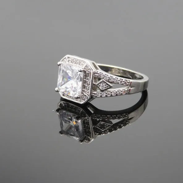 Women's geometric zircon ring with hollow design and platinum colour finish showing quadrilateral decorative elements