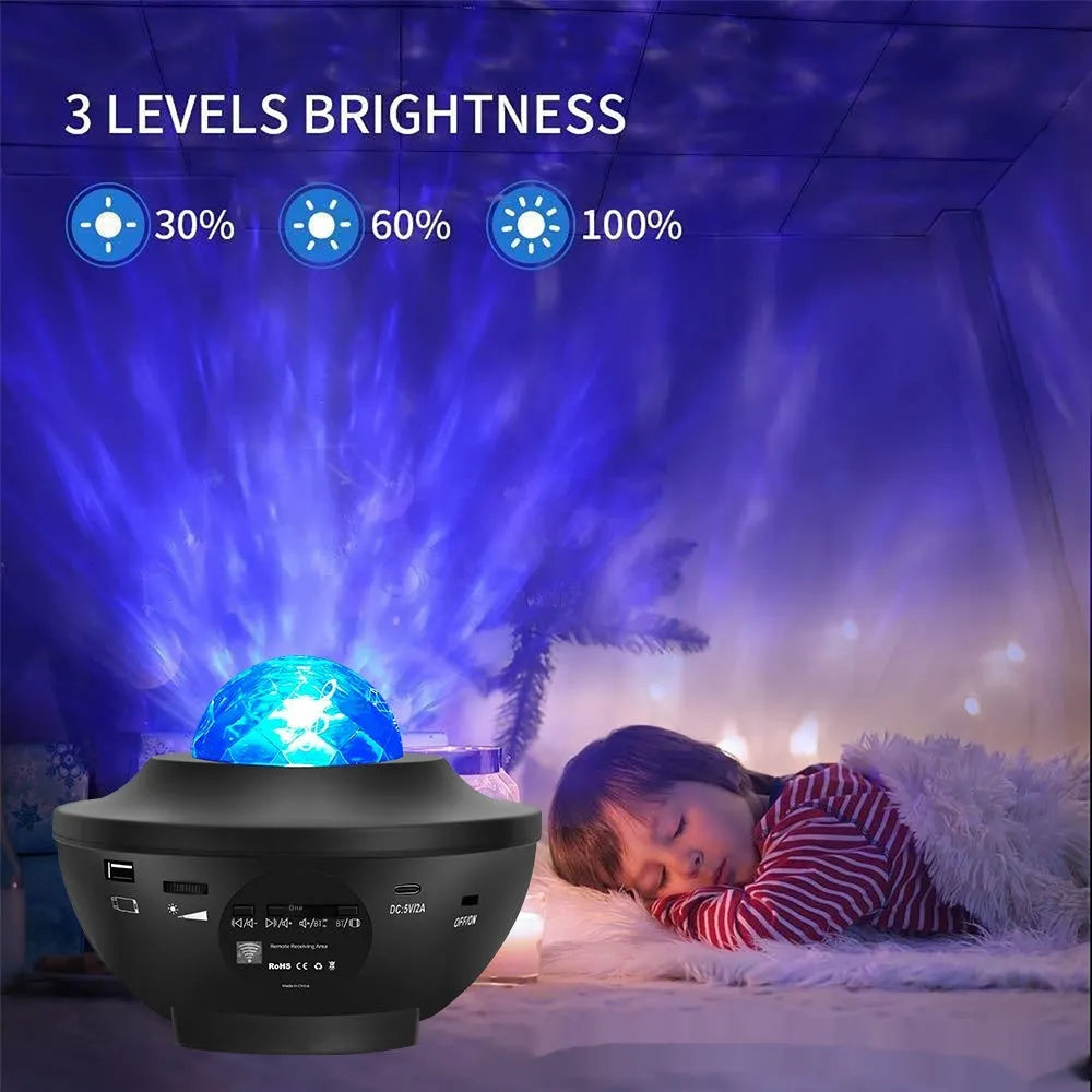 Black parallel starry sky projection lamp with USB cable and remote control on desktop
