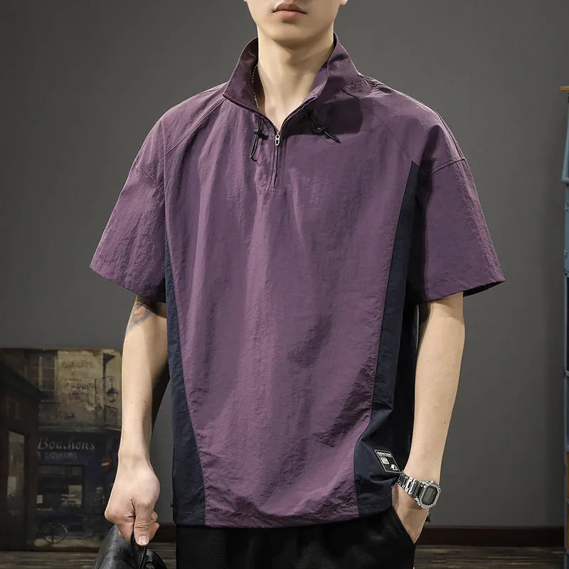Brown men's casual half-zip short-sleeve shirt with a stand collar, showing the fleece-lined interior and loose fit.