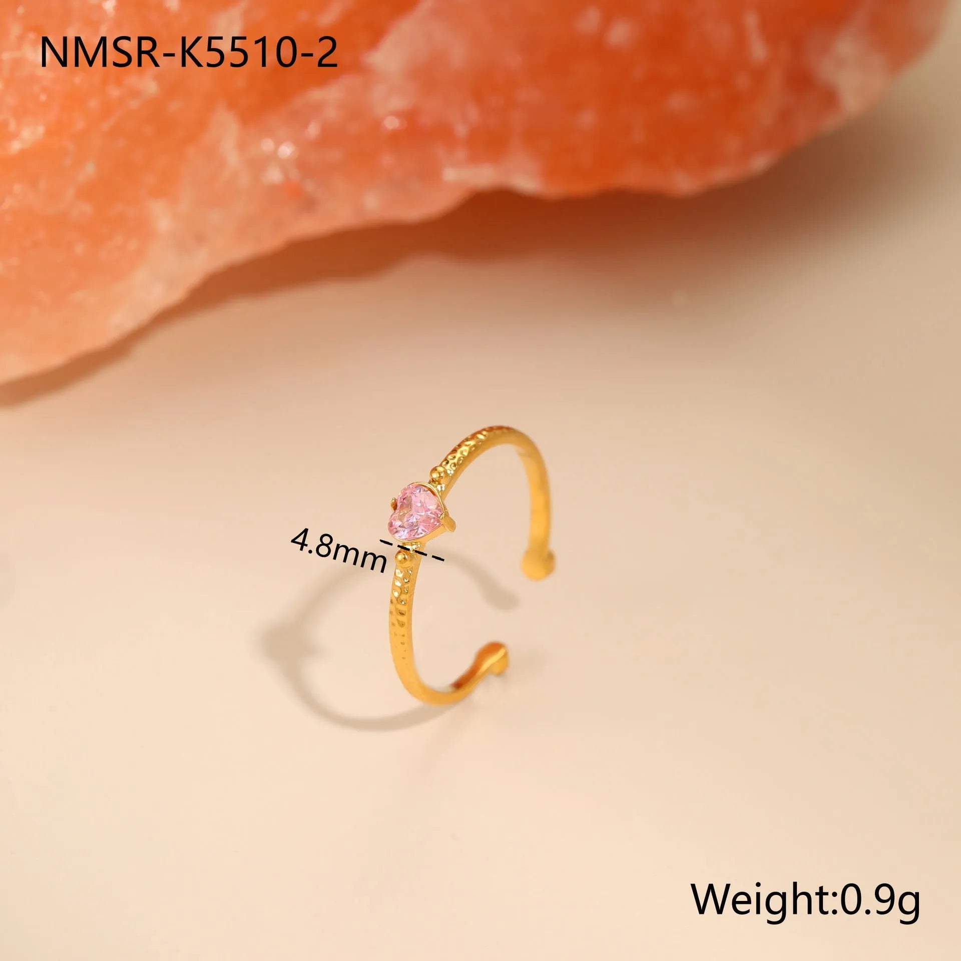 Open-ended stainless steel ring with a geometric heart shape and inlaid green zircon stone.