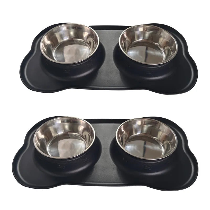 Large silicone double dog bowl in blue with two compartments for food and water on a kitchen floor.