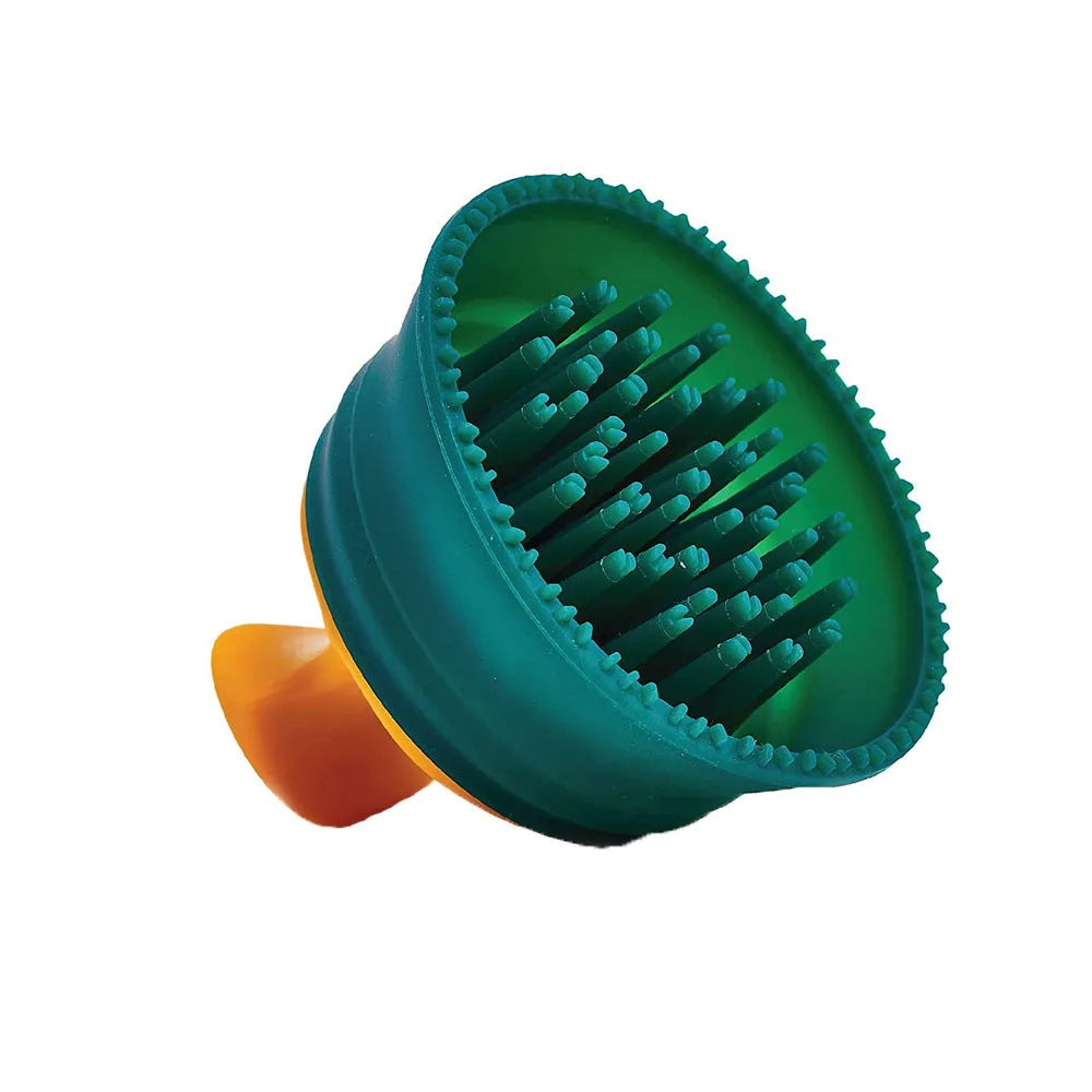 Green double-sided knotted silicone pet hair remover brush on a clean surface