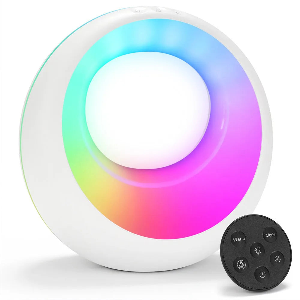 Small white RGB colour changing night lamp with remote control on wooden desk