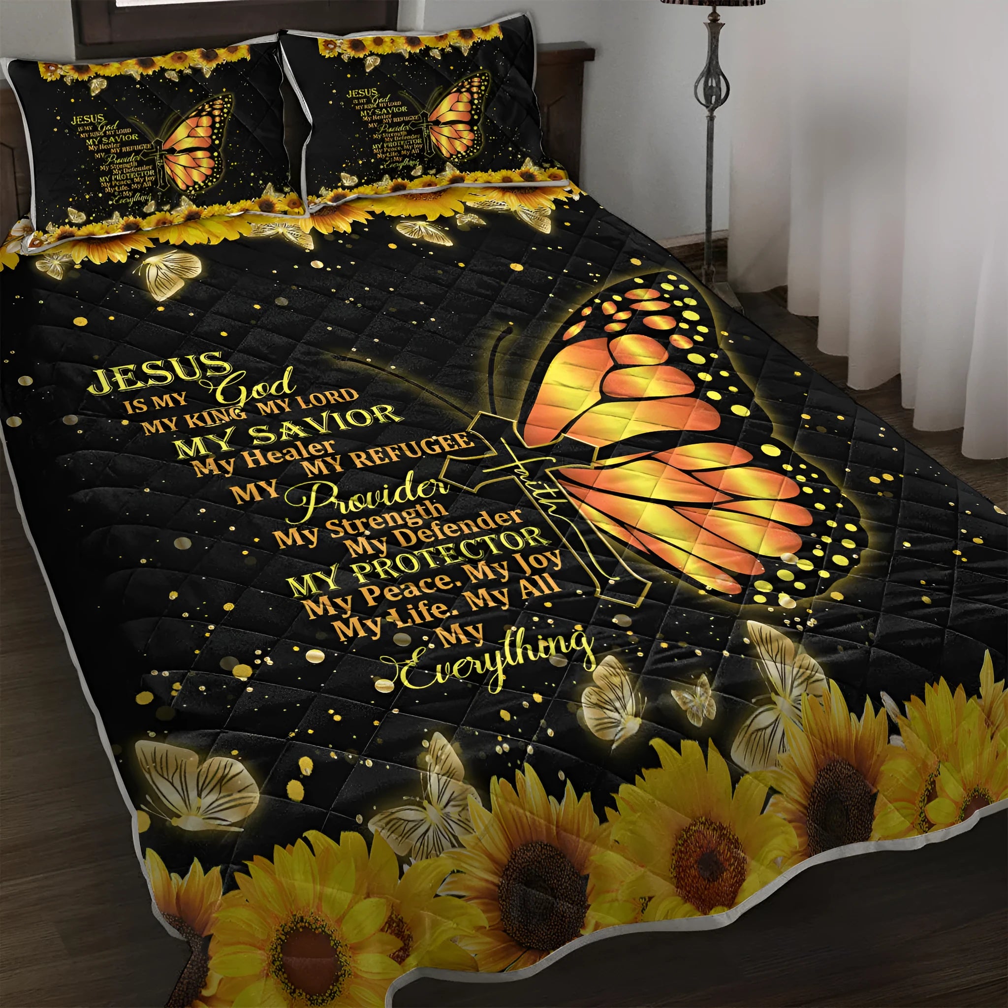 Butterfly and sunflower pattern 3-piece quilt set with 1 quilt and 2 pillow shams on a bed