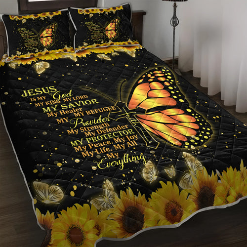 Butterfly and sunflower pattern 3-piece quilt set with 1 quilt and 2 pillow shams on a bed