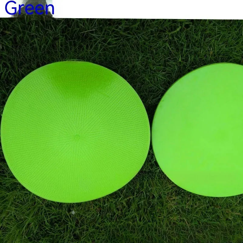 Soft yellow football landmark pad disc on grass, 23cm diameter, for training targets.