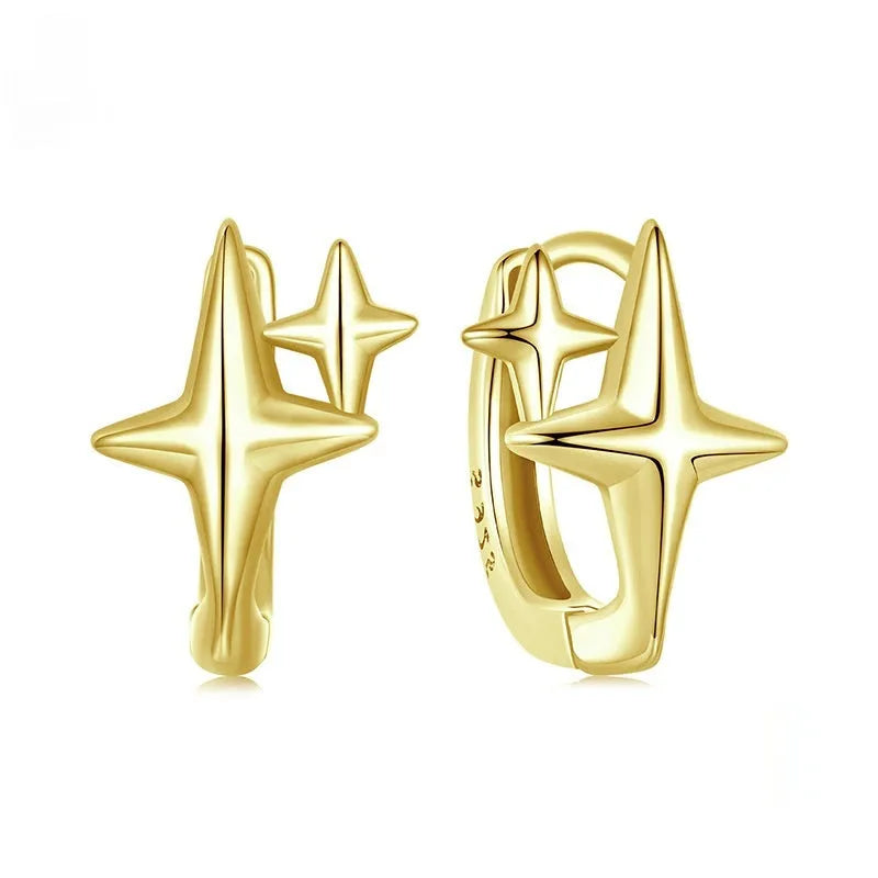 Minimalist star sterling silver ear clips with oxidation finish and XINGX design element